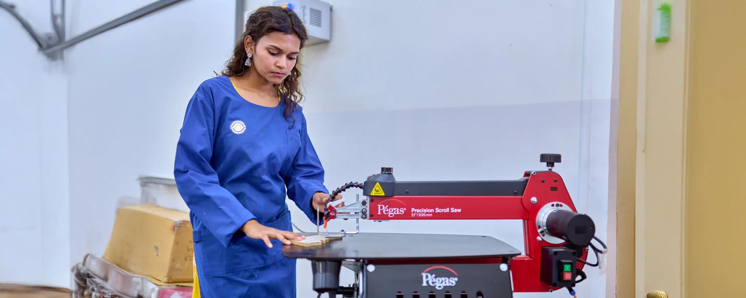 A student showcasing a design by hand.